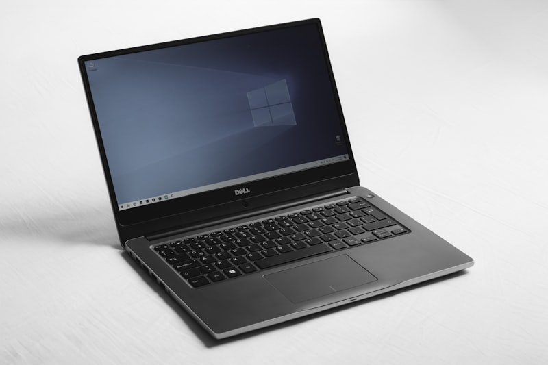 Business laptop on a plain background